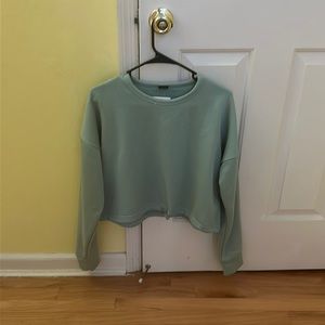 light blue, long sleeve crop top, size large